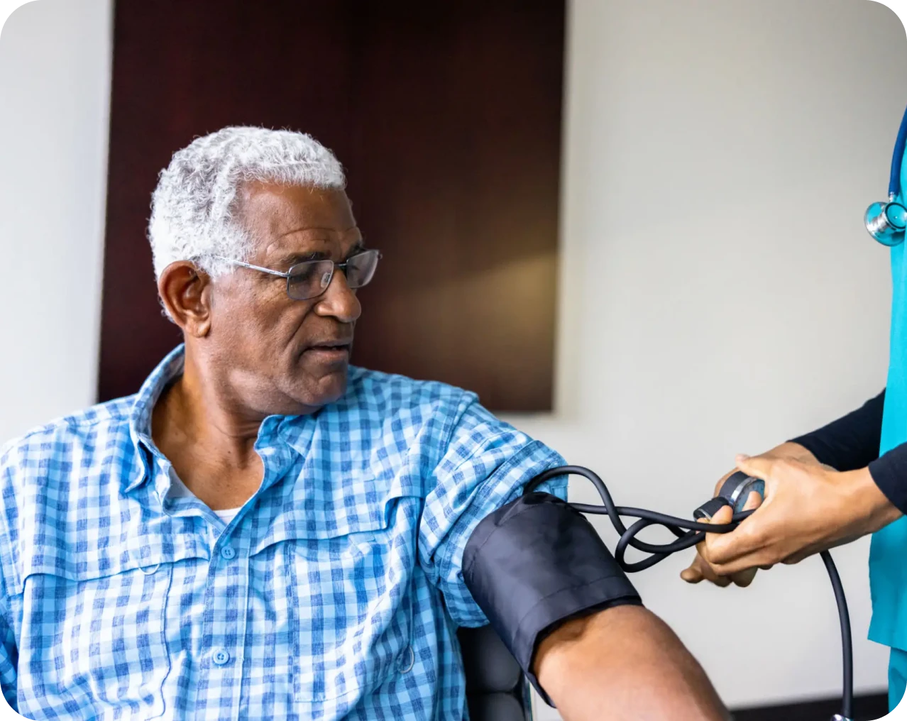 Healthcare professional measuring blood pressure